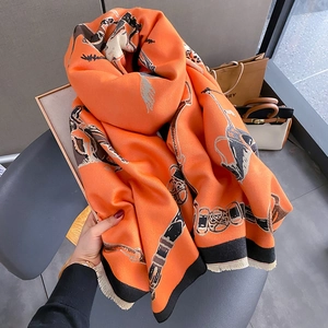 Orange equestrian print scarf with carriage motifs and tassels for a classic style