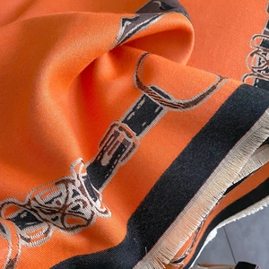 Detail of equestrian pattern shawl with tassels and thick high-quality woven fabric