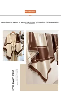 Detailed view of geometric brown and beige cashmere scarf with elegant fringe trim