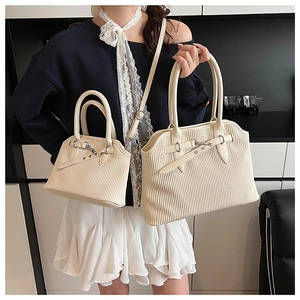 Size comparison of white pleated shell tote bags with adjustable silver buckles and straps