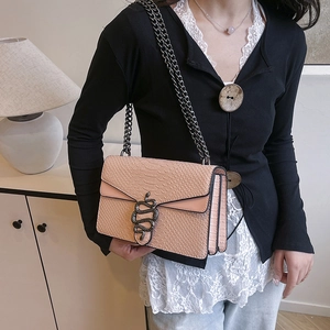 Pink embossed crocodile leather shoulder bag with vintage snake buckle and chain strap