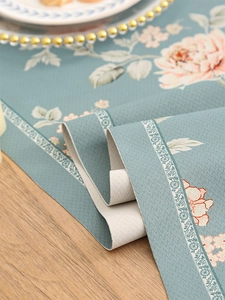 Close-up of luxury floral table runner with waterproof texture and elegant peony print