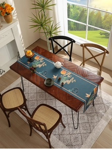 Detail of waterproof table runner featuring cranes and clouds in traditional style
