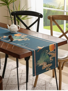 Detailed view of dark blue table runner with traditional crane and mountain print