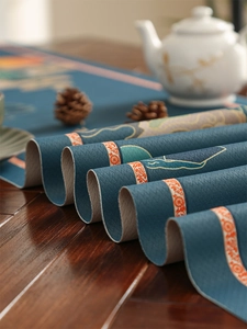 Detail of blue waterproof table runner with traditional mountain and cloud pattern