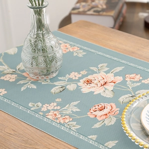 Waterproof floral table runner with pink peonies on elegant grey-blue textured fabric