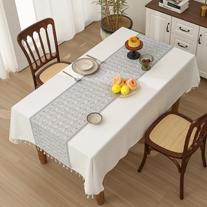 Rectangle white waffle tablecloth with grey geometric diamond pattern and white tassels
