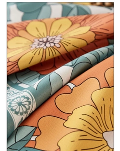 Macro shot of vintage floral waterproof tablecloth with retro orange and green patterns