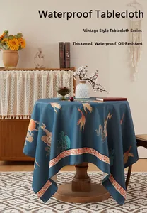 Detail of round waterproof tablecloth with crane and sun pattern in retro style