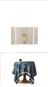 Detail of thickened linen tablecloth with golden crane pattern and retro oriental design