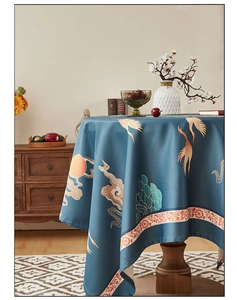 Detail of waterproof tablecloth with traditional crane and cloud pattern on round table