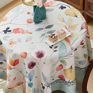 Round thick linen tablecloth with watercolor leaf patterns and teal border for dining table