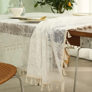 White minimalist lace tablecloth with elegant tassels and boho jacquard branch patterns
