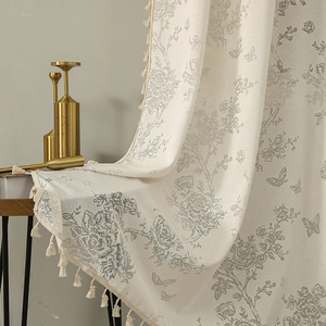 Floral butterfly jacquard sheer curtain with tassel trim in elegant off-white