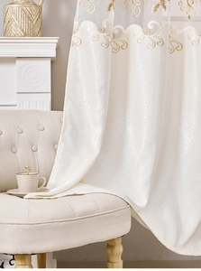 Close-up of European style beige embroidered curtain with gold wavy stitching and floral jacquard