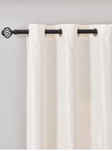 Detail of cream chenille curtain featuring elegant floral jacquard and silver grommets