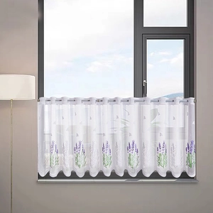 Detail of lavender floral embroidery on white lace cafe curtain with scalloped hem edges