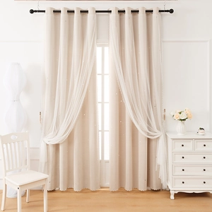 Close-up of double-layer blackout curtains with hollow stars and white lace tulle