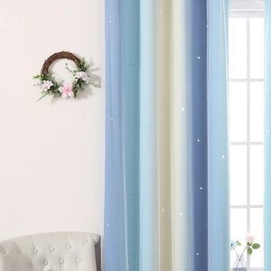 Detail view of double-layer rainbow curtains with laser-cut stars in blue and yellow gradient