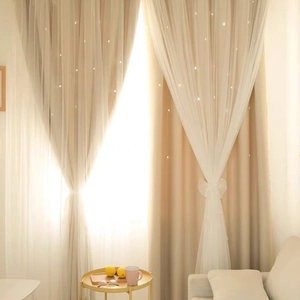 Double-layered rainbow curtains with hollowed-out star patterns and white lace overlay