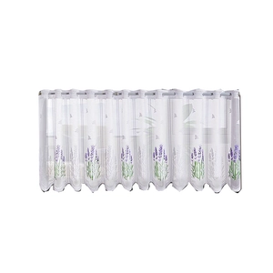 White semi-transparent cafe curtain with lavender print and metal grommet top headers
