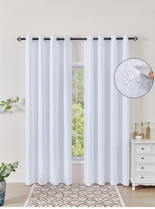 Detail of white grommet curtains with geometric patterns and waterproof fabric surface