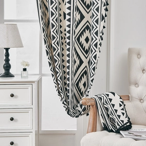 Bohemian black and white geometric print linen curtain with decorative black pom poms