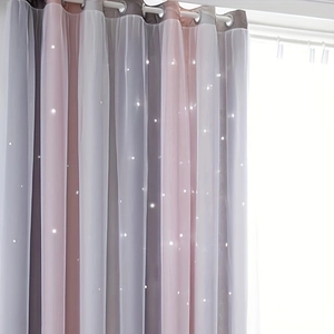Close-up of rainbow gradient curtain featuring hollow out stars and metal ring grommets