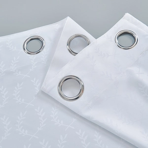 White jacquard outdoor curtain with leaf pattern and silver metal grommets at the top