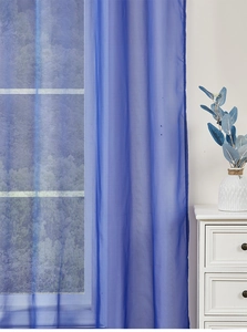 Detail of blue semi-transparent outdoor chiffon curtain with soft light filtration effect