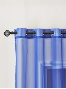 Detail of blue semi-transparent grommet top voile curtain with silver metal rings