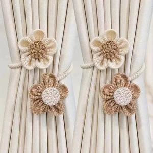 Handcrafted woven flower curtain tiebacks in beige and light brown rustic cotton rope