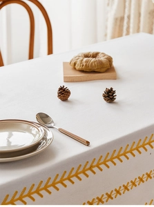 Detail of Nordic style embroidered rectangle tablecloth with yellow geometric wheat pattern