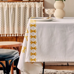 Nordic vintage white tablecloth with yellow embroidery and geometric textured edge