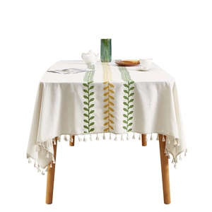 Ivory Nordic tassel tablecloth with green leaf embroidery and premium linen texture
