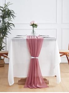 Detail of dusty rose chiffon table runner showing soft sheer texture and elegant draping