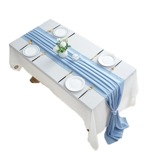 Minimalist light blue chiffon table runner with elegant draped pleats on white tablecloth