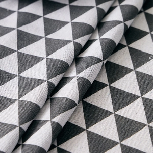 Close-up of geometric triangle pattern on thick cotton linen tablecloth fabric