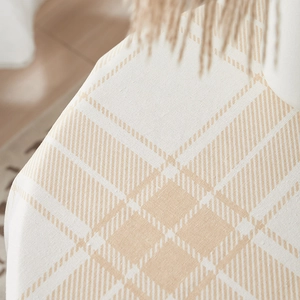 Close-up of brown plaid cotton linen tablecloth showing thick woven texture and draping