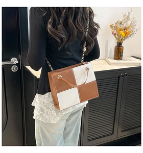 Stylish brown and white color-blocked square shoulder bag with gold chain strap detail