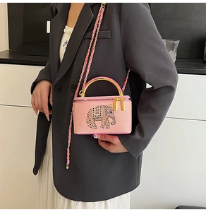Pink box evening bag with sparkling crystal elephant motif and golden chain strap