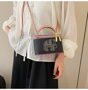 Fashionable black denim mini box bag with pink trim and sparkling rhinestone elephant detail