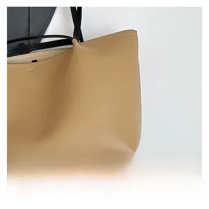Close-up of premium khaki tote bag with detailed stitching and high-quality leather texture