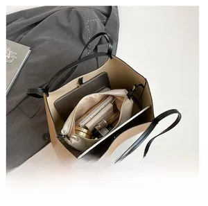 Spacious beige tote bag showing interior storage for tablet and cosmetics