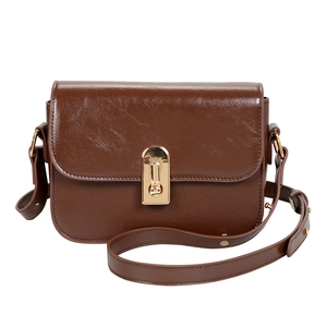 Retro brown leather crossbody bag with golden clasp closure and adjustable strap