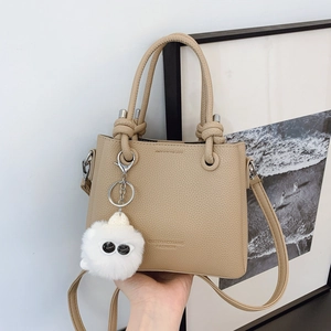 Women Litchi Grain PU Leather Bucket Bag Versatile Crossbody Handbag With Plush Monster Charm Elegant Commuter Shoulder Bag