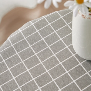 Detailed macro view of gray checkered cotton linen tablecloth with woven texture