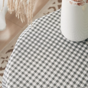 Macro view of grey gingham cotton linen tablecloth with premium woven texture detail