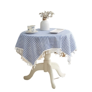 Blue and white plaid cotton linen tablecloth with fringe tassels on round table