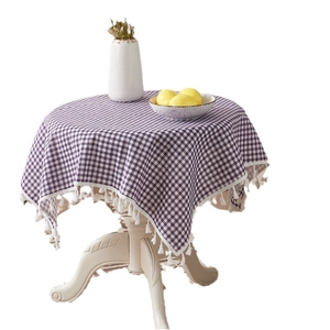 Purple and white checkered round linen tablecloth with white decorative tassel fringe
